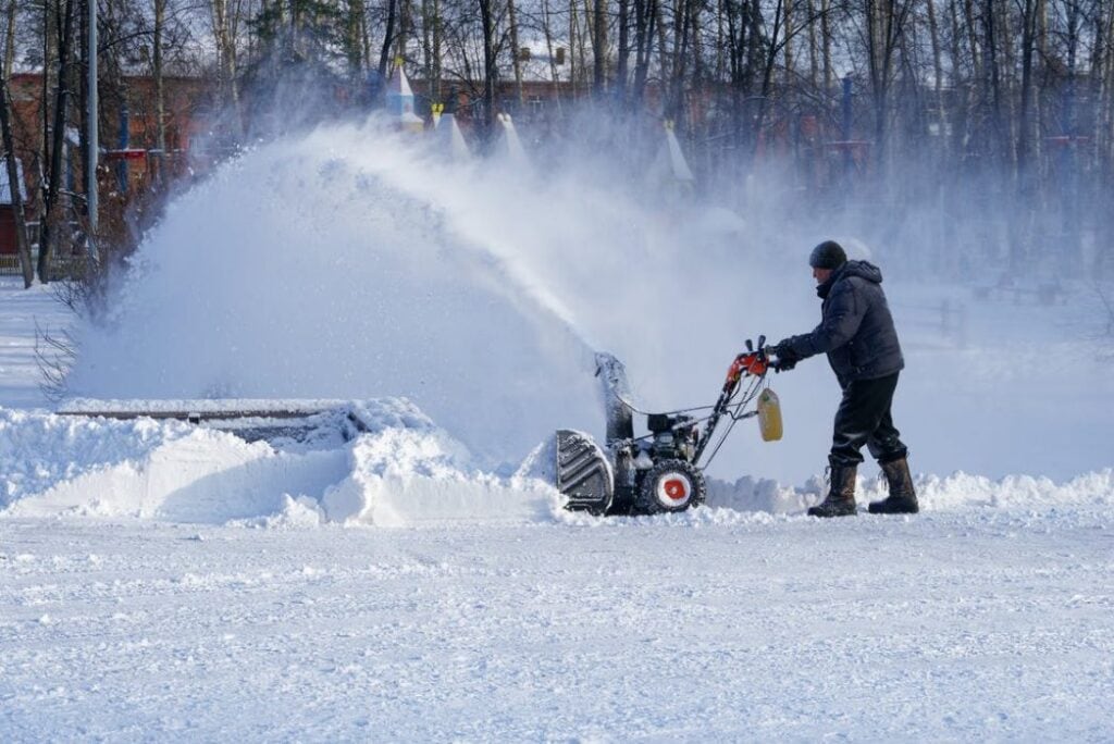 man removing snow with snow blower · free stock ph